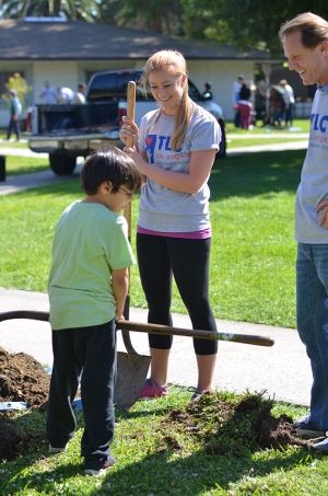 Lauren Wood holding Shovel at the Los Angeles Trial Lawyers’ Charity Event